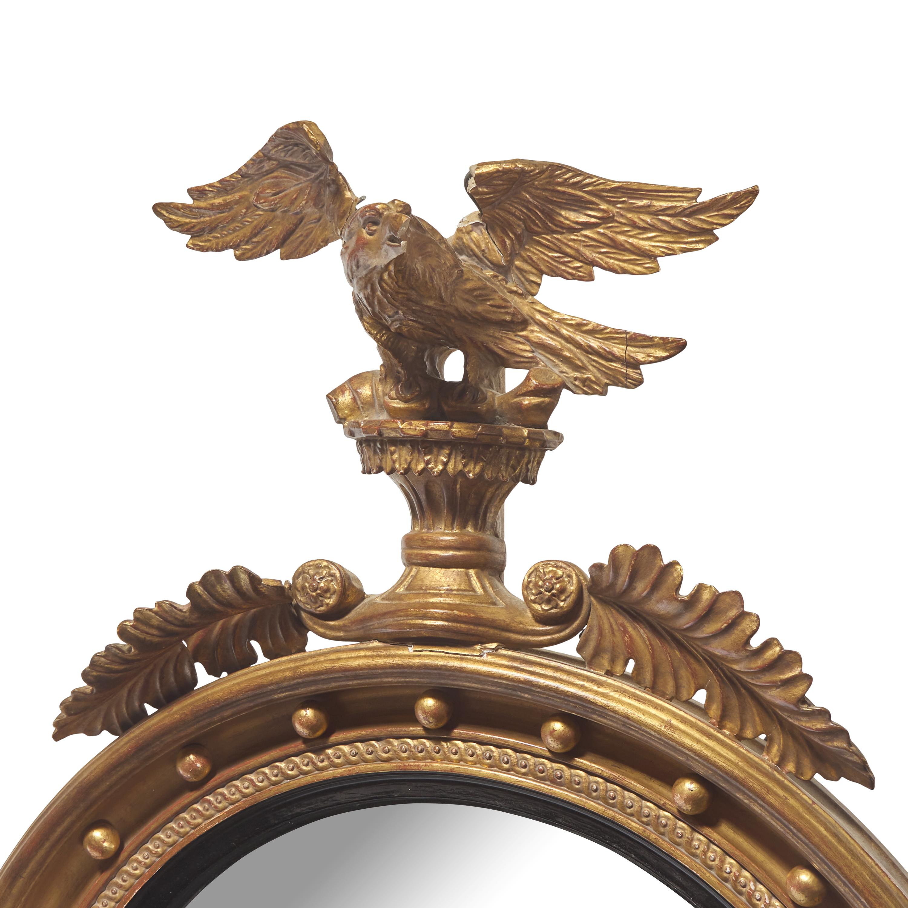 A Regency Style Giltwood Bull's Eye Looking Glass