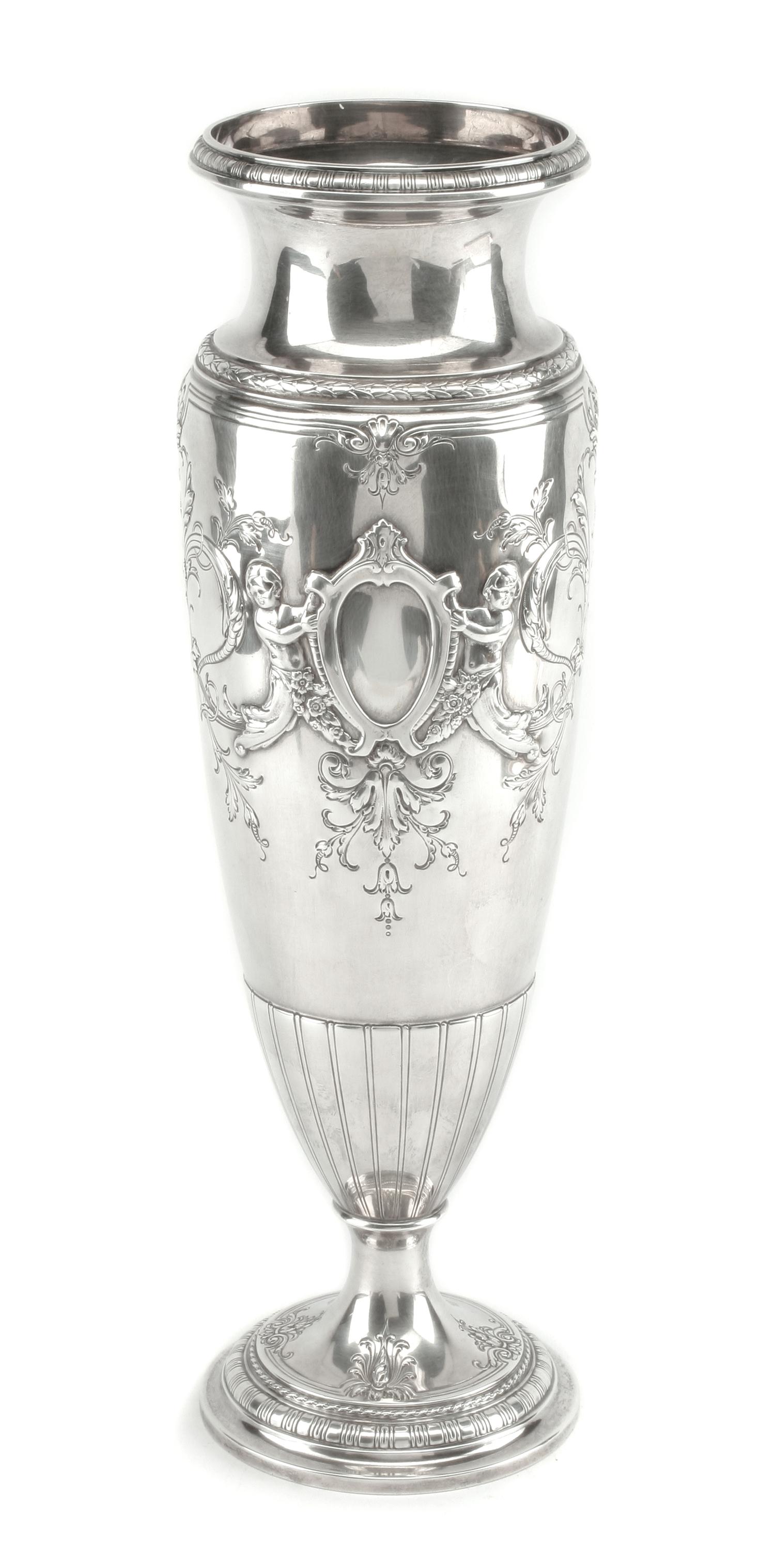 An American Silver Vase, International Silver Co., Meriden, CT, of elongated baluster form, the body worked to show two vacant cartouch