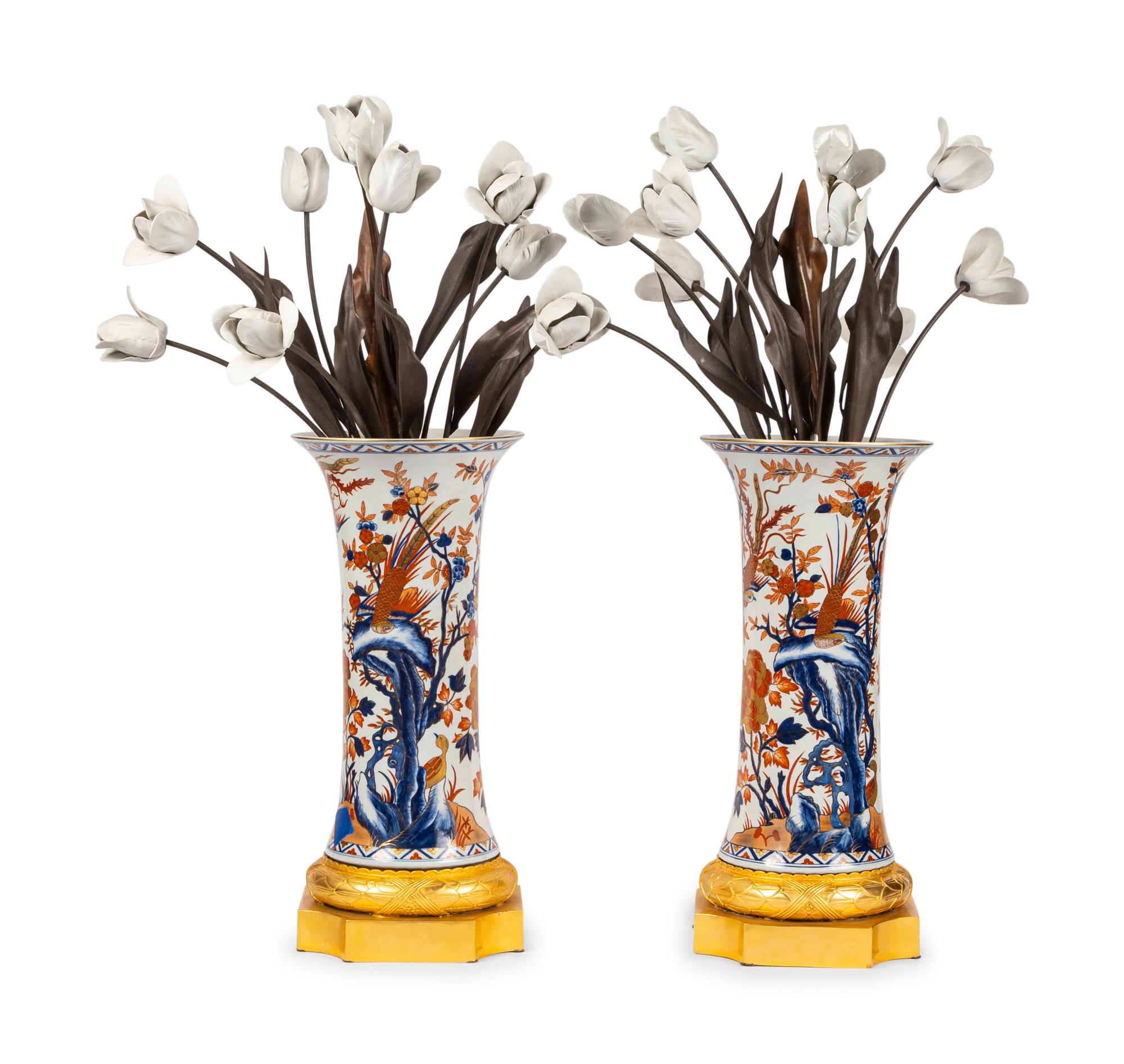 A Pair of Gilt Bronze Mounted Imari Palette Porcelain Vases with Biscuit Porcelain Tulip Arrangements