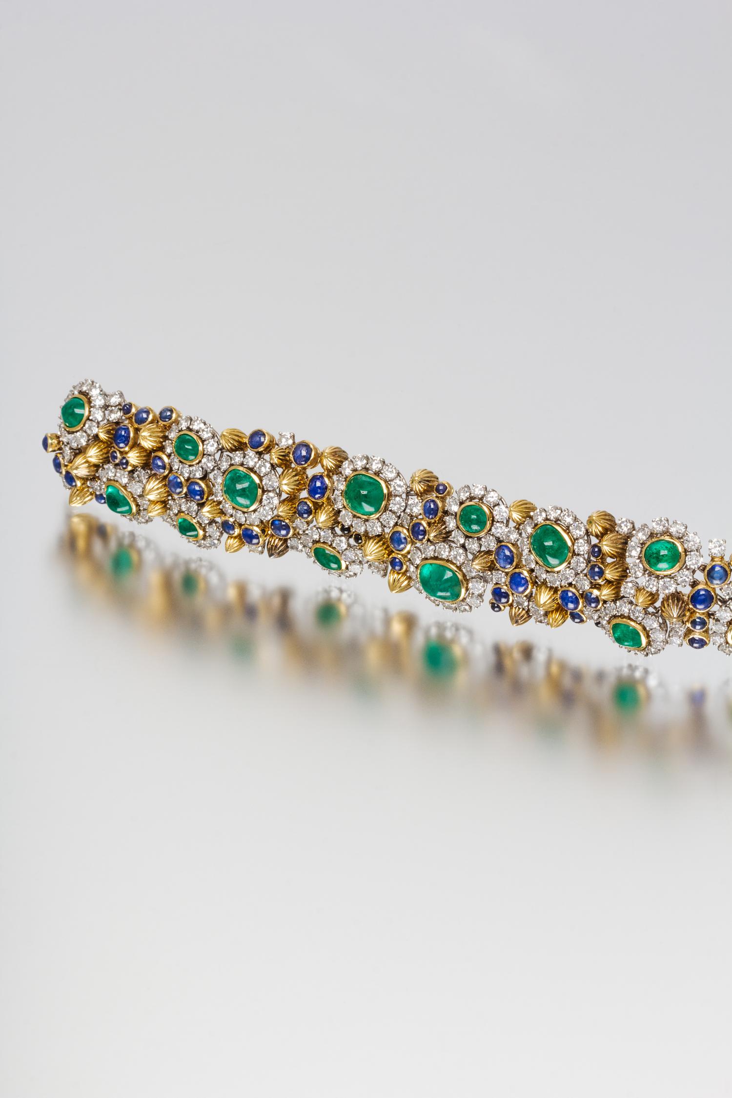 A Platinum, Yellow Gold, Diamond, Emerald and Sapphire Bracelet, 17.30 dwts.