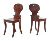 A Pair of Regency Style Mahogany Hall Chairs