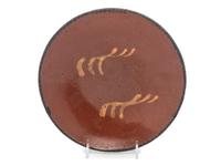 A Redware Slip Glazed Plate