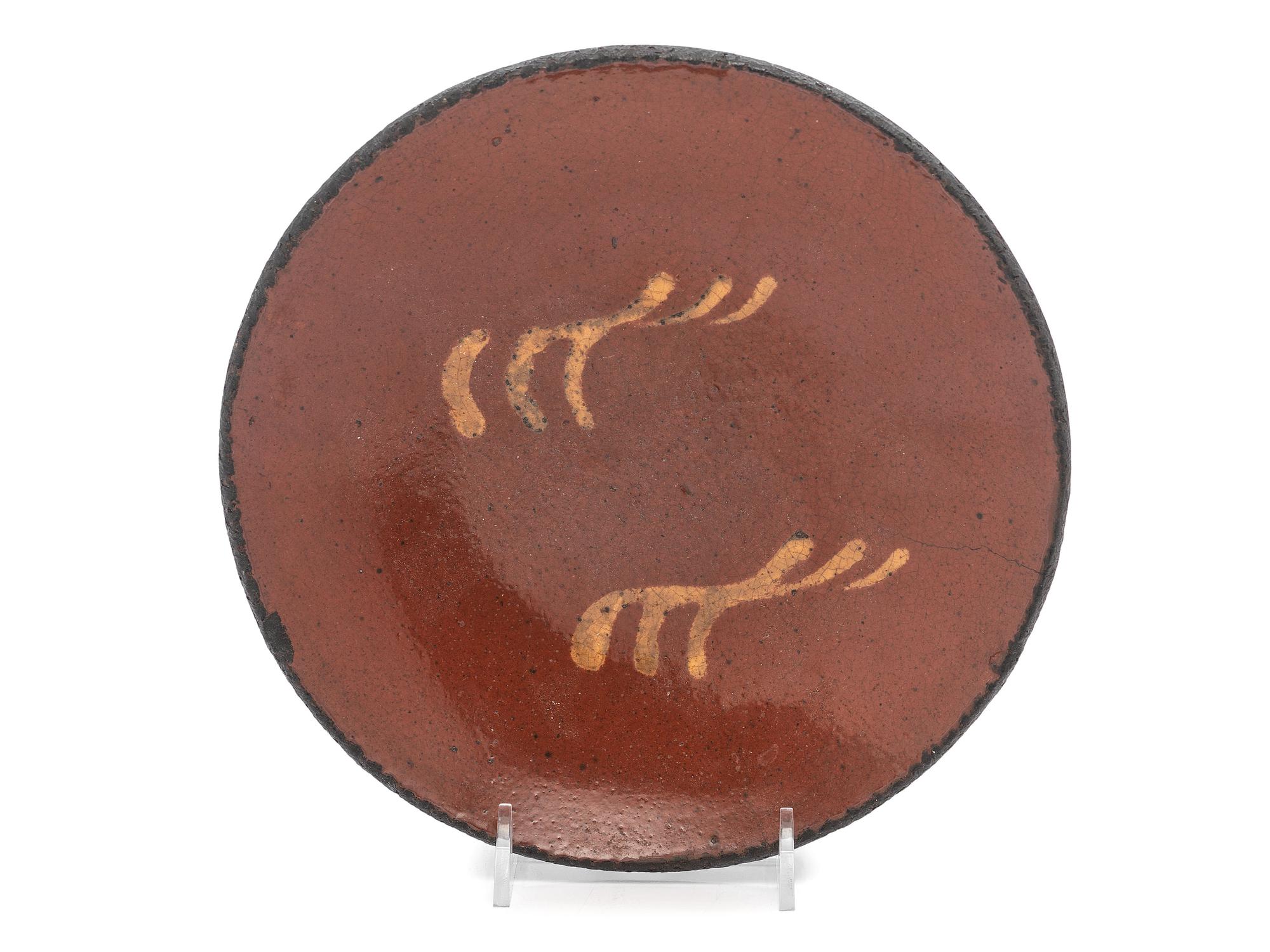 A Redware Slip Glazed Plate