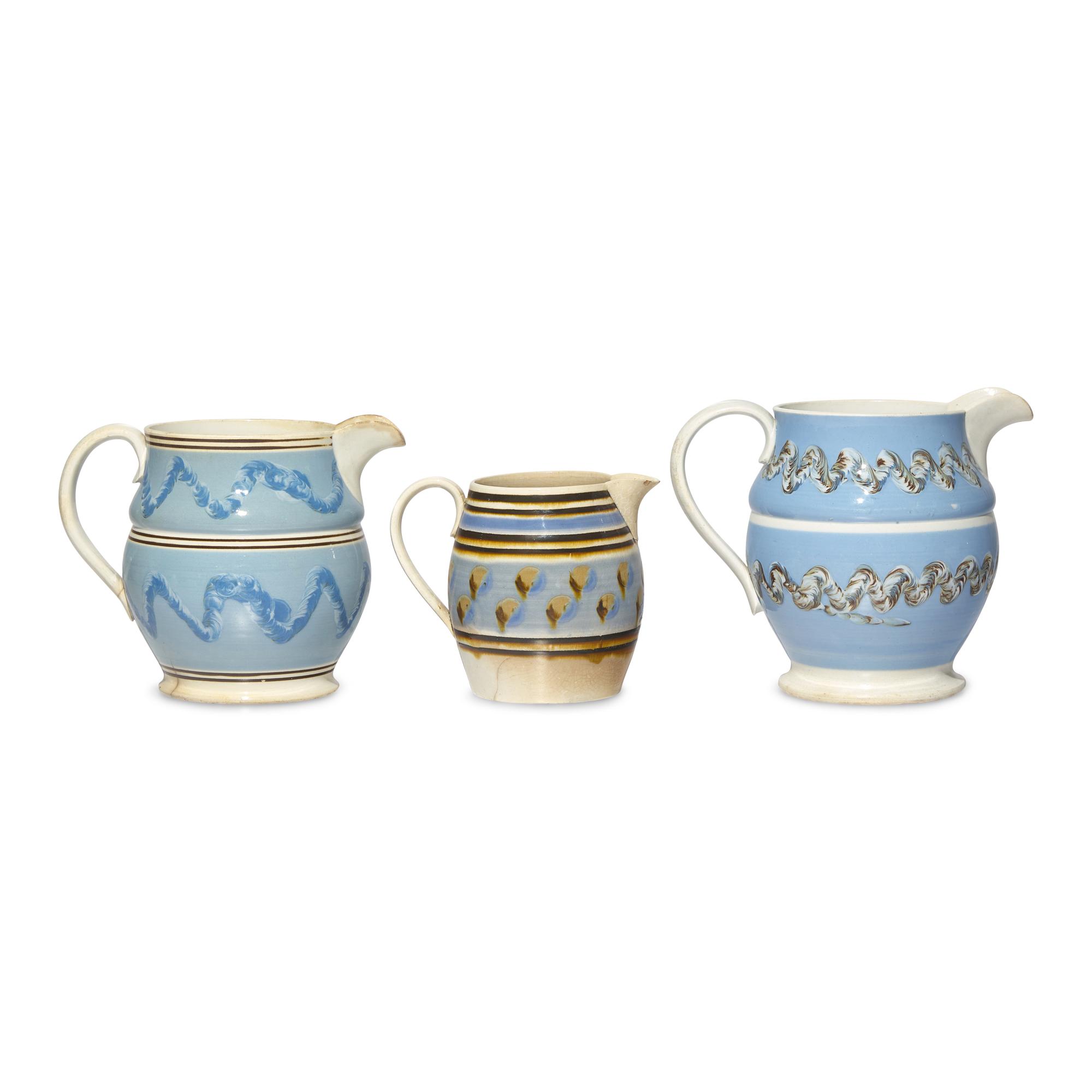 A Group of Three Mochaware Pitchers