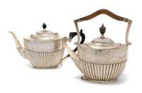 A Group of Two English Silver Teapots, Width of largest 12 inches.