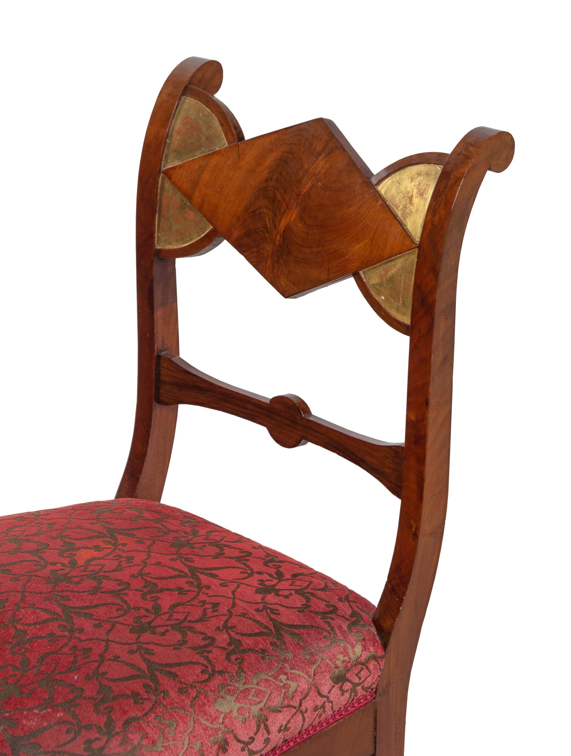 A Set of Six German Parcel Gilt Mahogany Dining Chairs