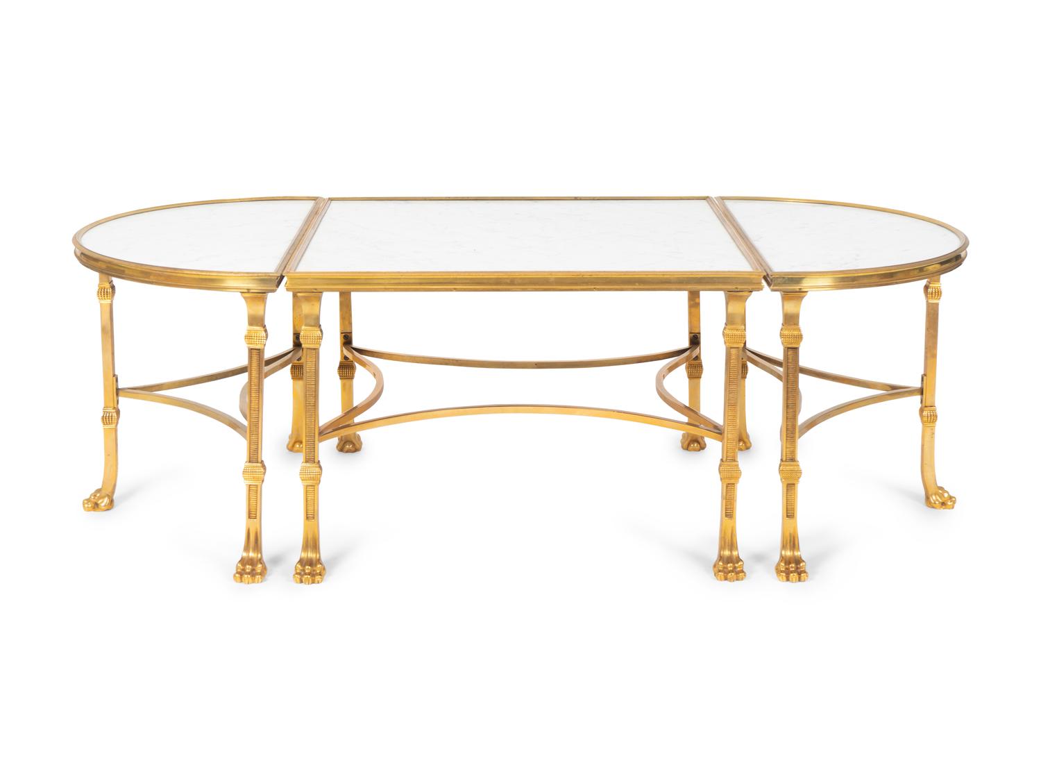 A Louis XVI Style Gilt Bronze and Marble Three Piece Cocktail Table — IN THE MANNER OF MAISON JANSEN
