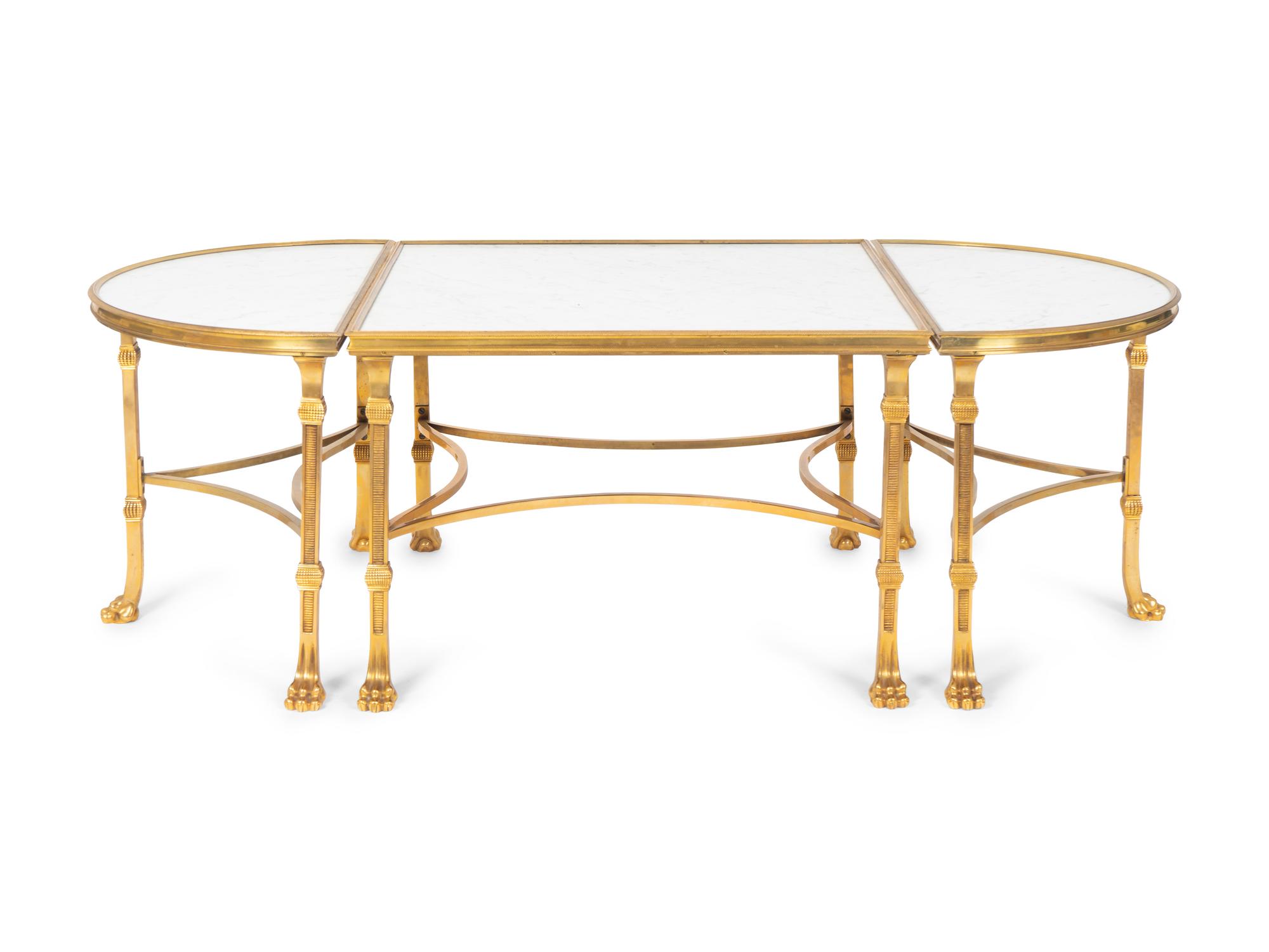 A Louis XVI Style Gilt Bronze and Marble Three Piece Cocktail Table — IN THE MANNER OF MAISON JANSEN