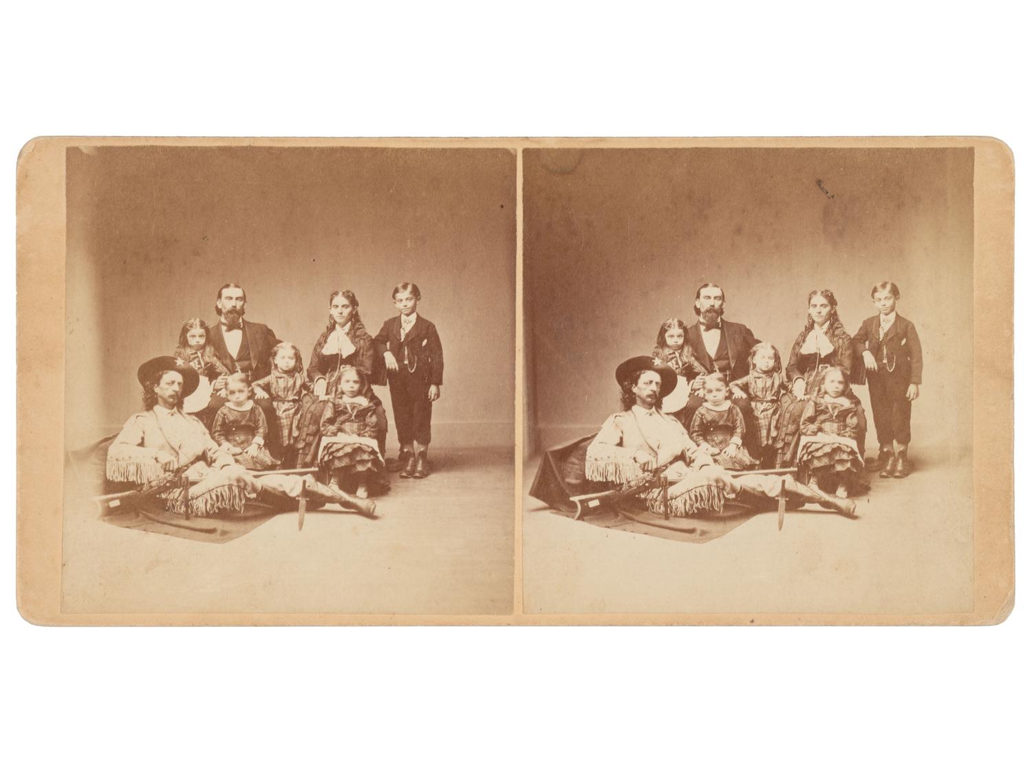 [WESTERN AMERICANA]. Stereoview portrait of Maj. Samuel S. "Buckskin Sam" Hall & the Dutcher family.