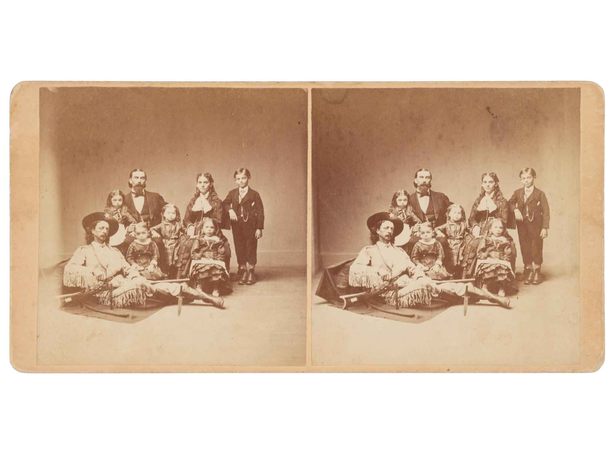 [WESTERN AMERICANA]. Stereoview portrait of Maj. Samuel S. "Buckskin Sam" Hall & the Dutcher family.