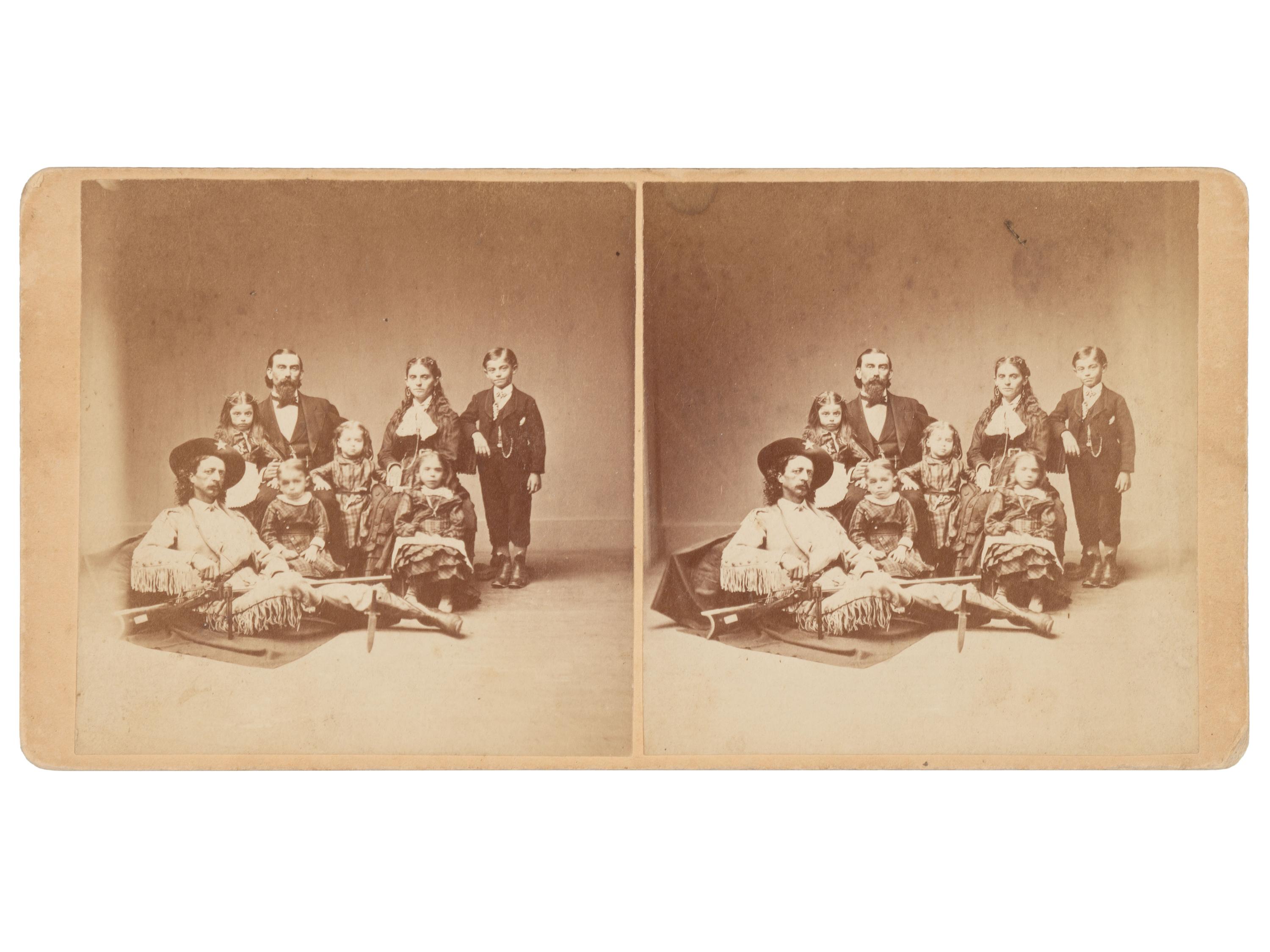 [WESTERN AMERICANA]. Stereoview portrait of Maj. Samuel S. "Buckskin Sam" Hall & the Dutcher family.
