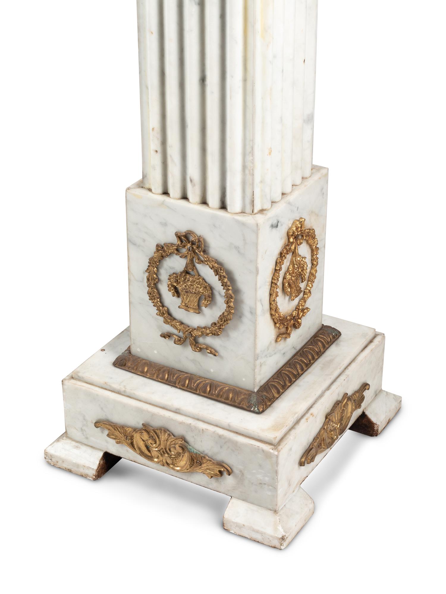 A Pair of Louis XVI Style Gilt Bronze Mounted White Marble Pedestals