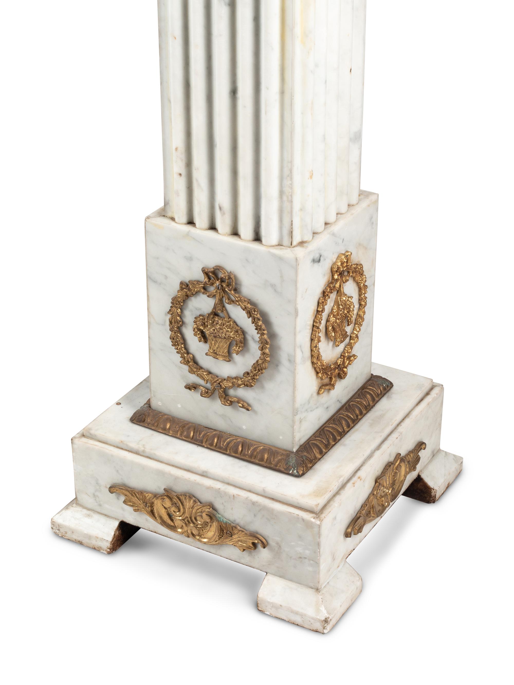 A Pair of Louis XVI Style Gilt Bronze Mounted White Marble Pedestals