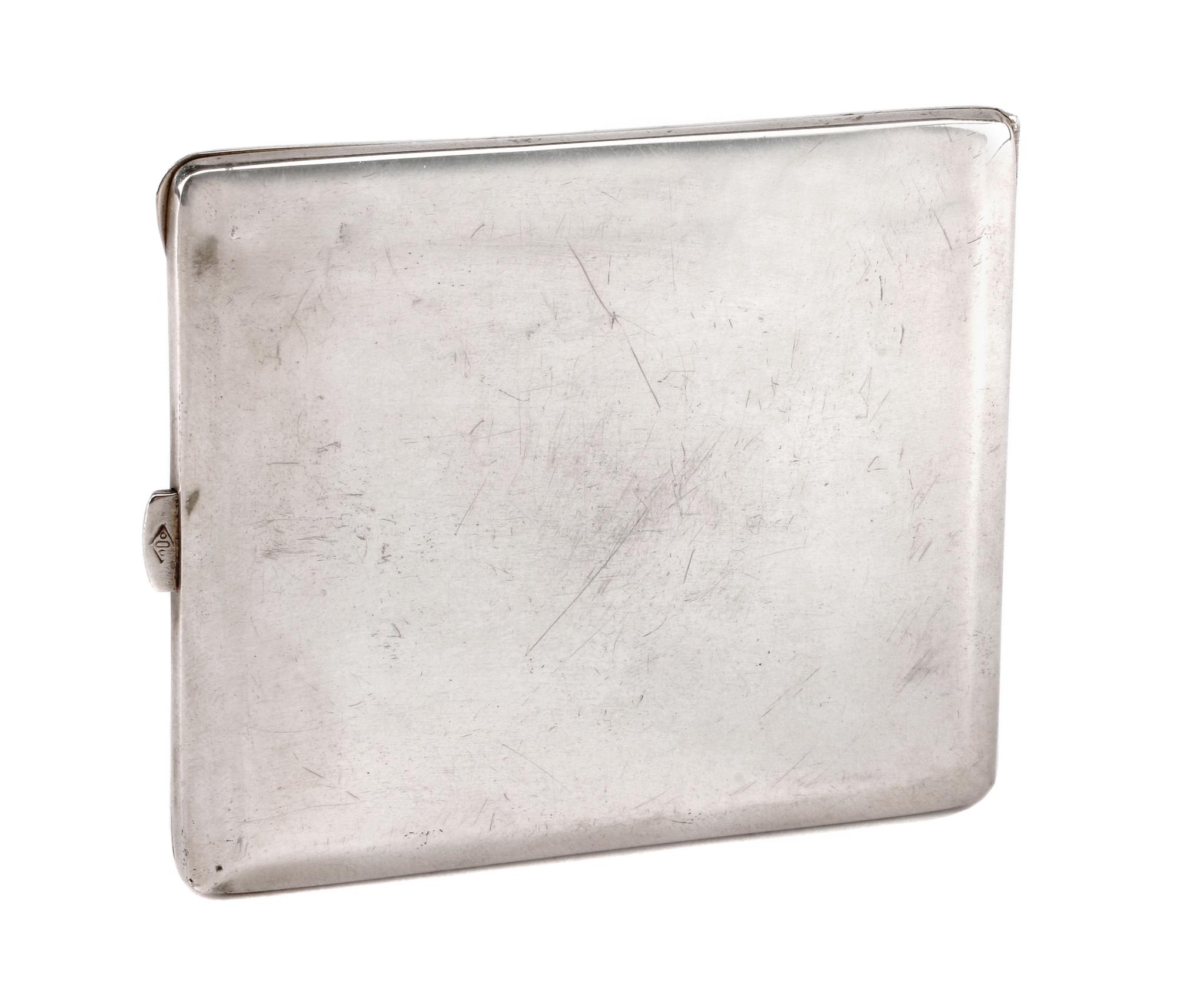 An Enameled Silvered Metal Cigarette Case, Early 20th Century, the lid enameled to show a seated nude playing two flutes in a garden se