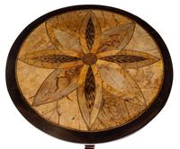 A Specimen Wood Pedestal Table Height 27 x diameter 24 1/2 inches.