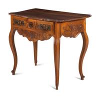 A Louis XV Provincial Carved Walnut Table