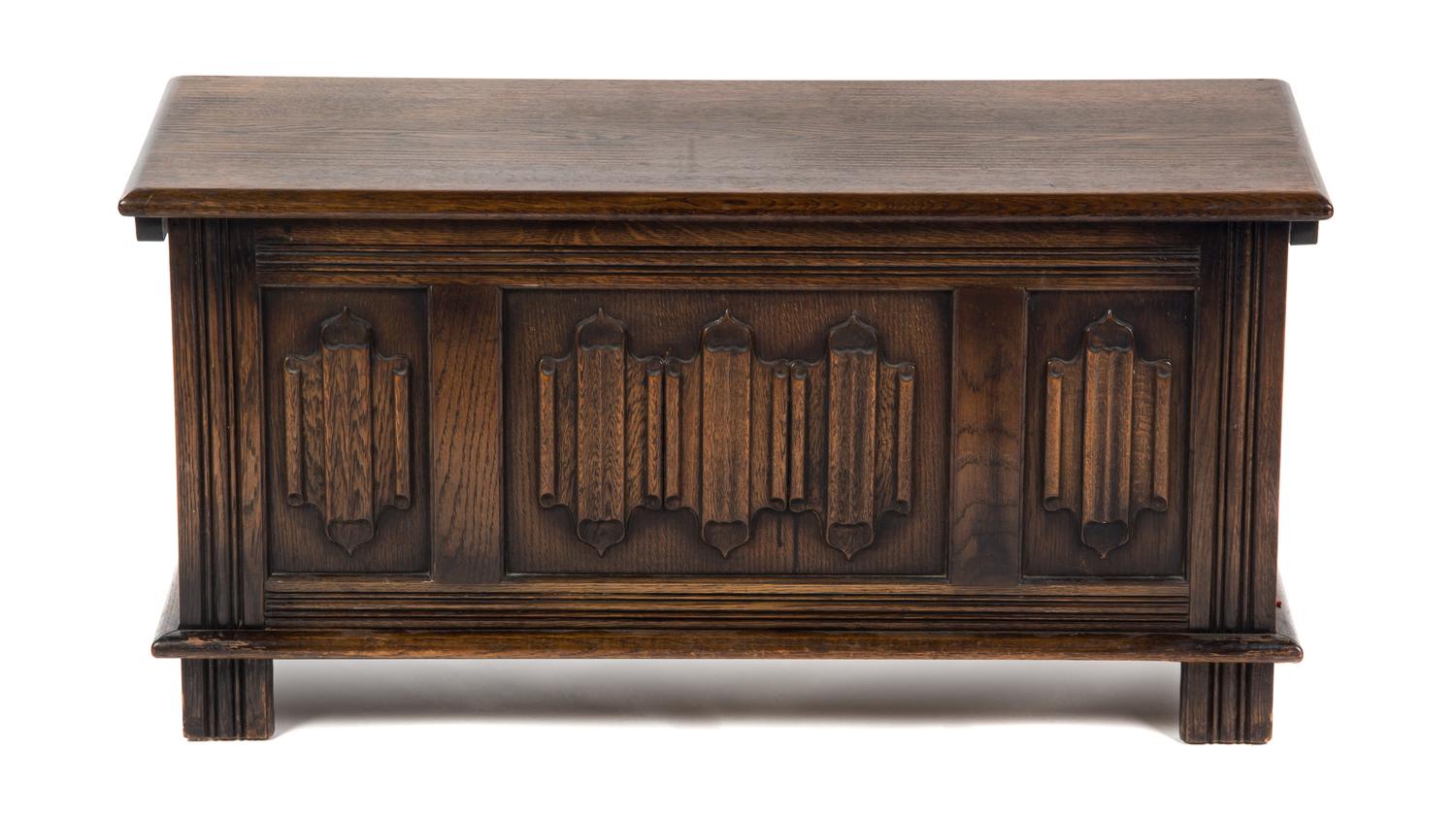 A Gothic Revival Oak Chest, Height 18 1/2 x width 37 1/2 x depth 15 inches.