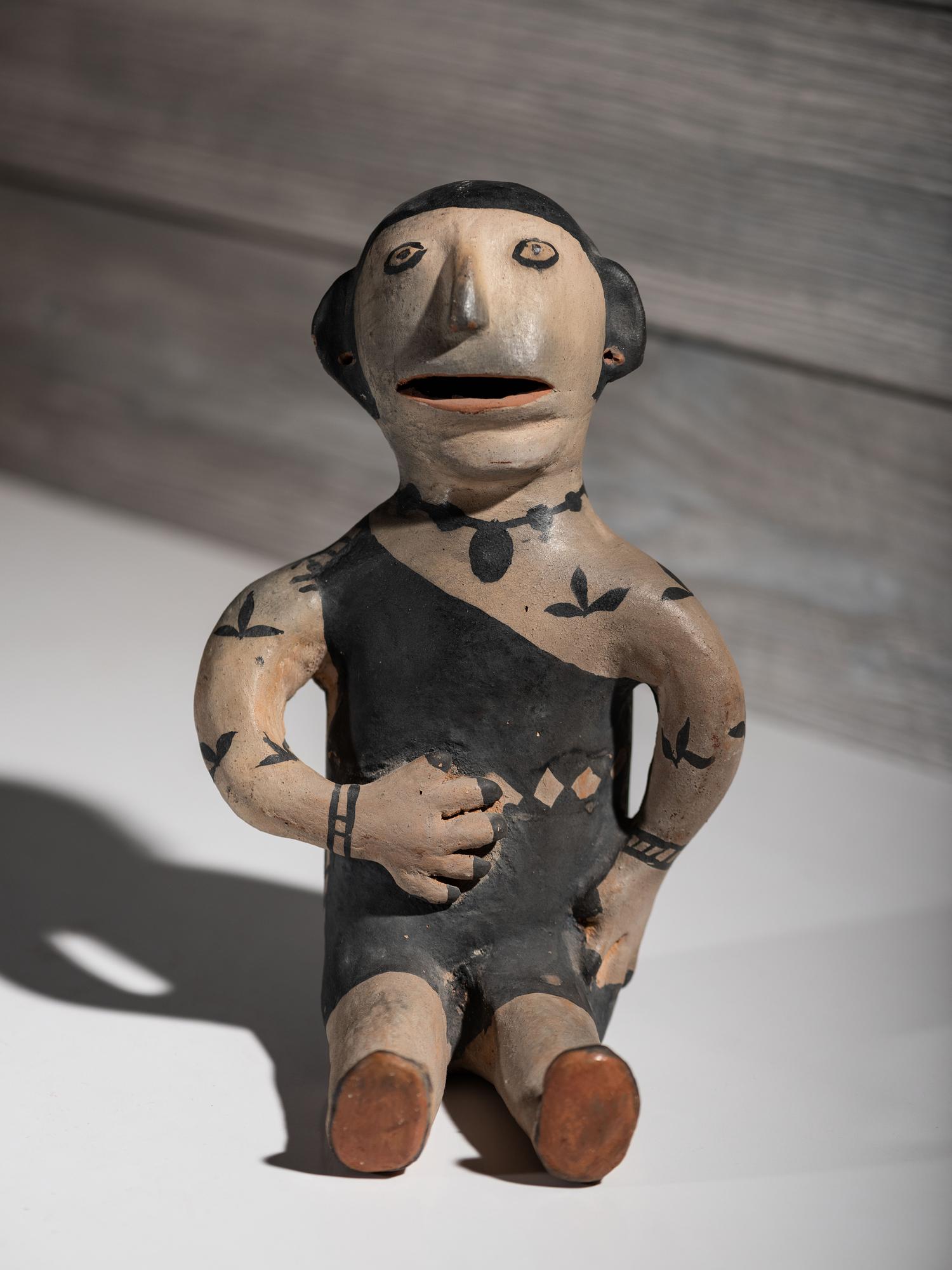 Seated Cochiti Pottery Figure
