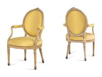 A Pair of George III Carved, Grey-Painted and Parcel Gilt Armchairs