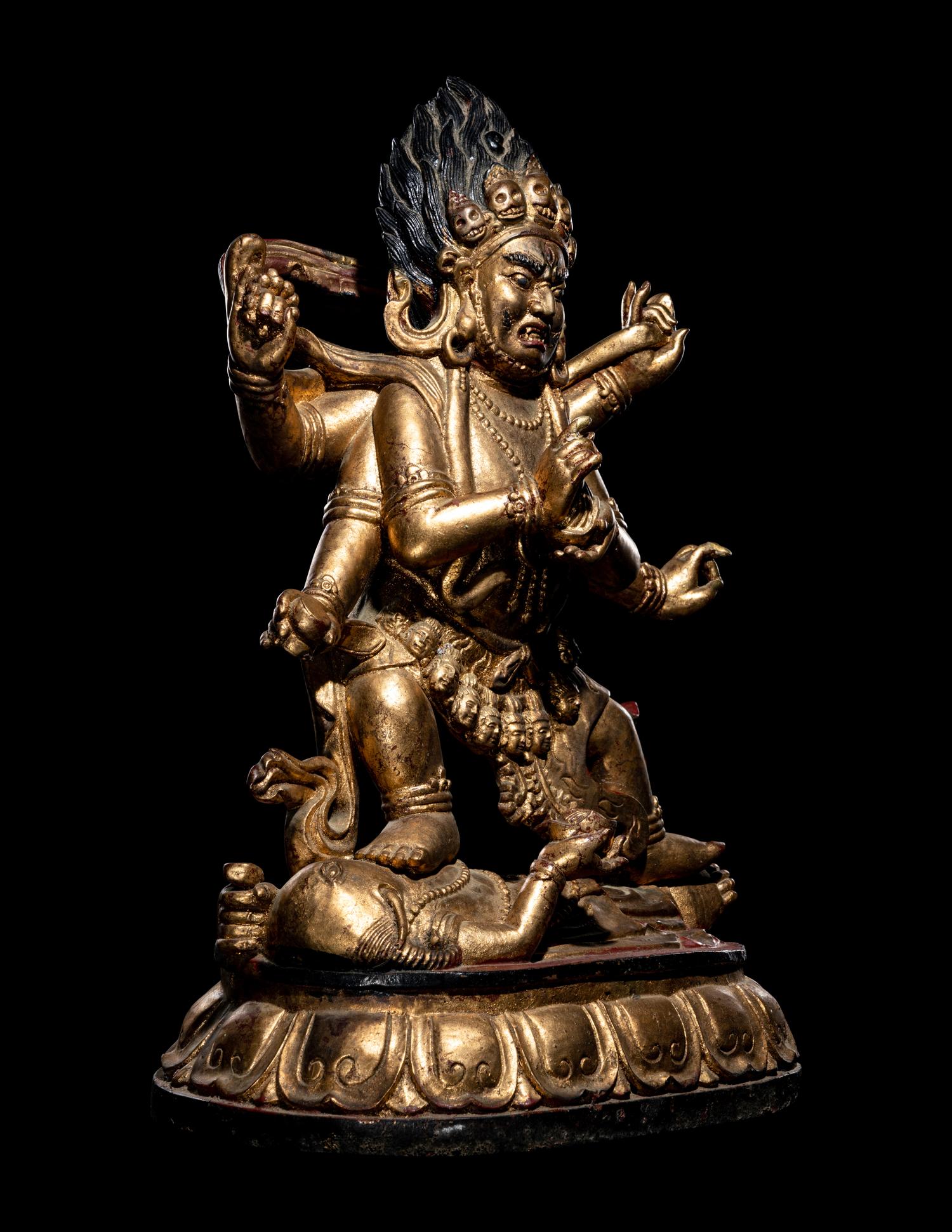 A Large Sino-Tibetan Gilt and Red Lacquered Wood Figure of a Mahākāla
