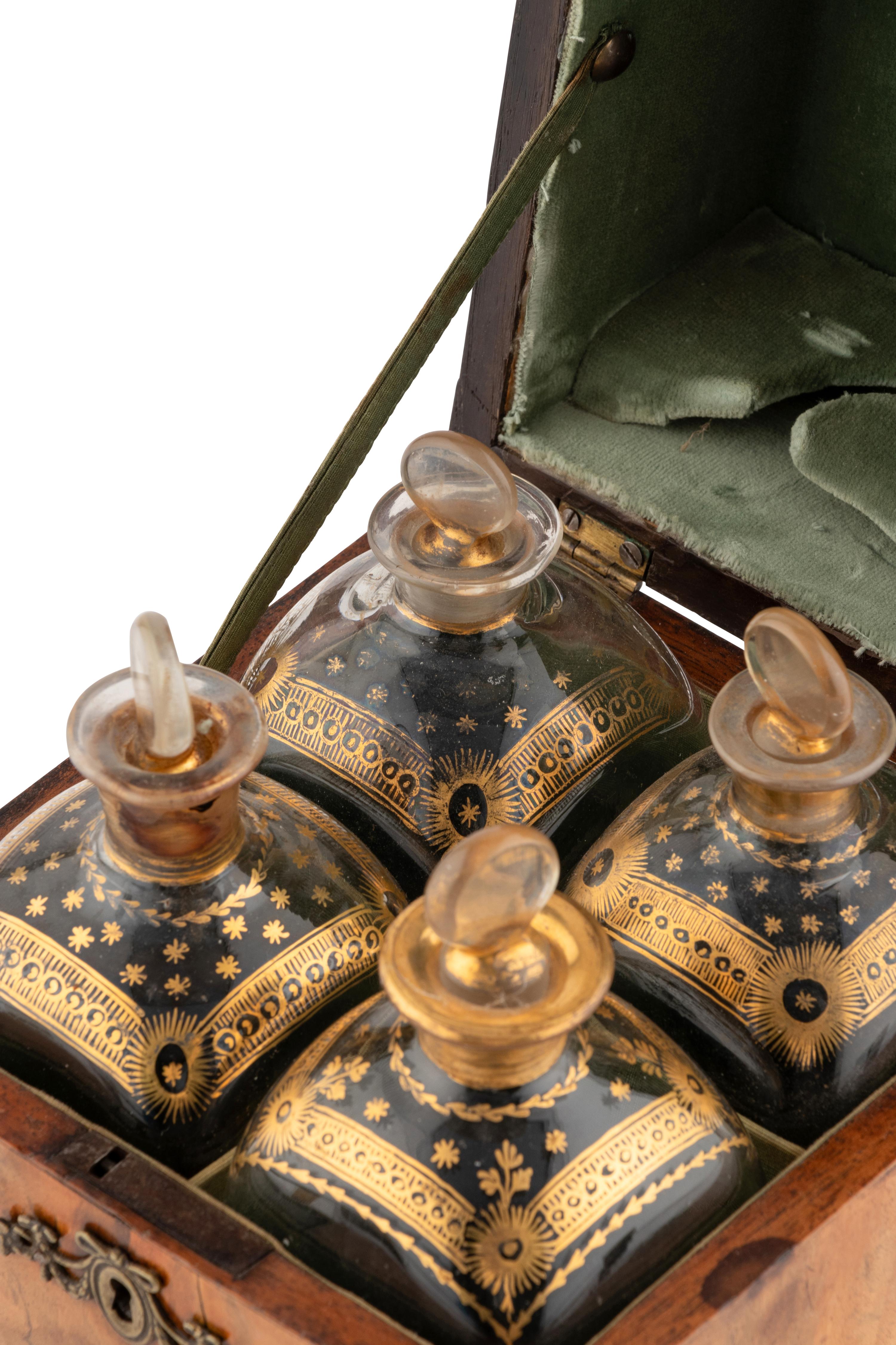 A Walnut and Mahogany Tantalus and Three Silver-Mounted Horn Tumblers