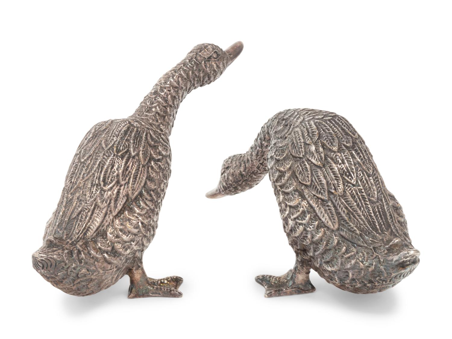 Two Silver Duck Figures