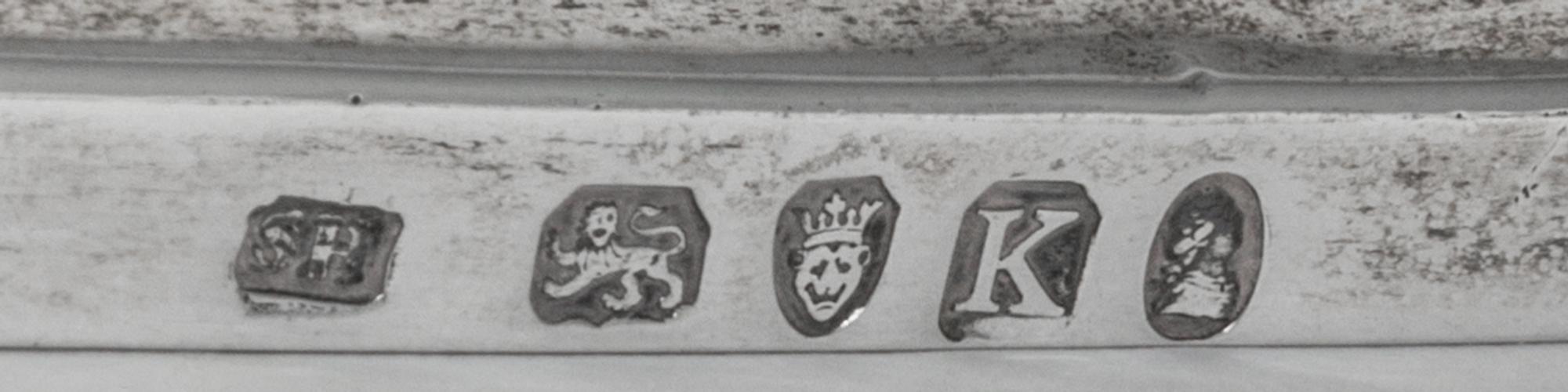 A George III Silver Basket, Solomon Hougham, London, 1805, with a swing handle and a gadrooned border.