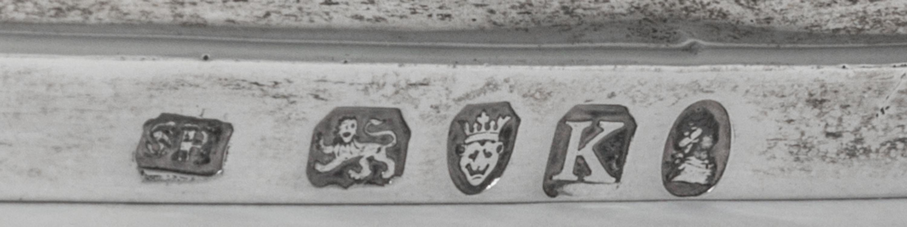 A George III Silver Basket, Solomon Hougham, London, 1805, with a swing handle and a gadrooned border.