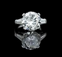 A Platinum and Round Brilliant Cut Diamond Ring, 6.20 dwts.