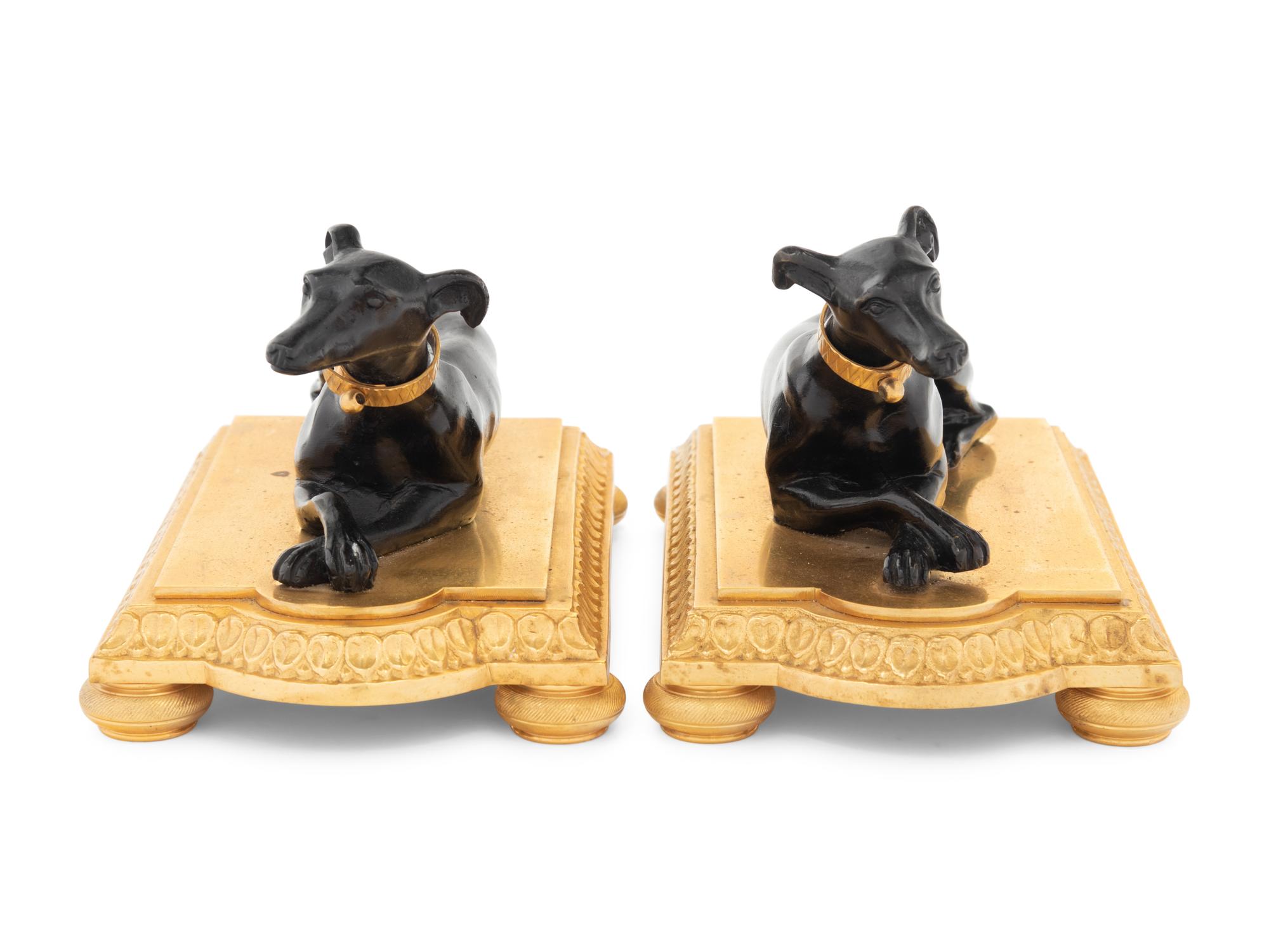 A Pair of French Gilt and Patinated Bronze Models of Greyhounds