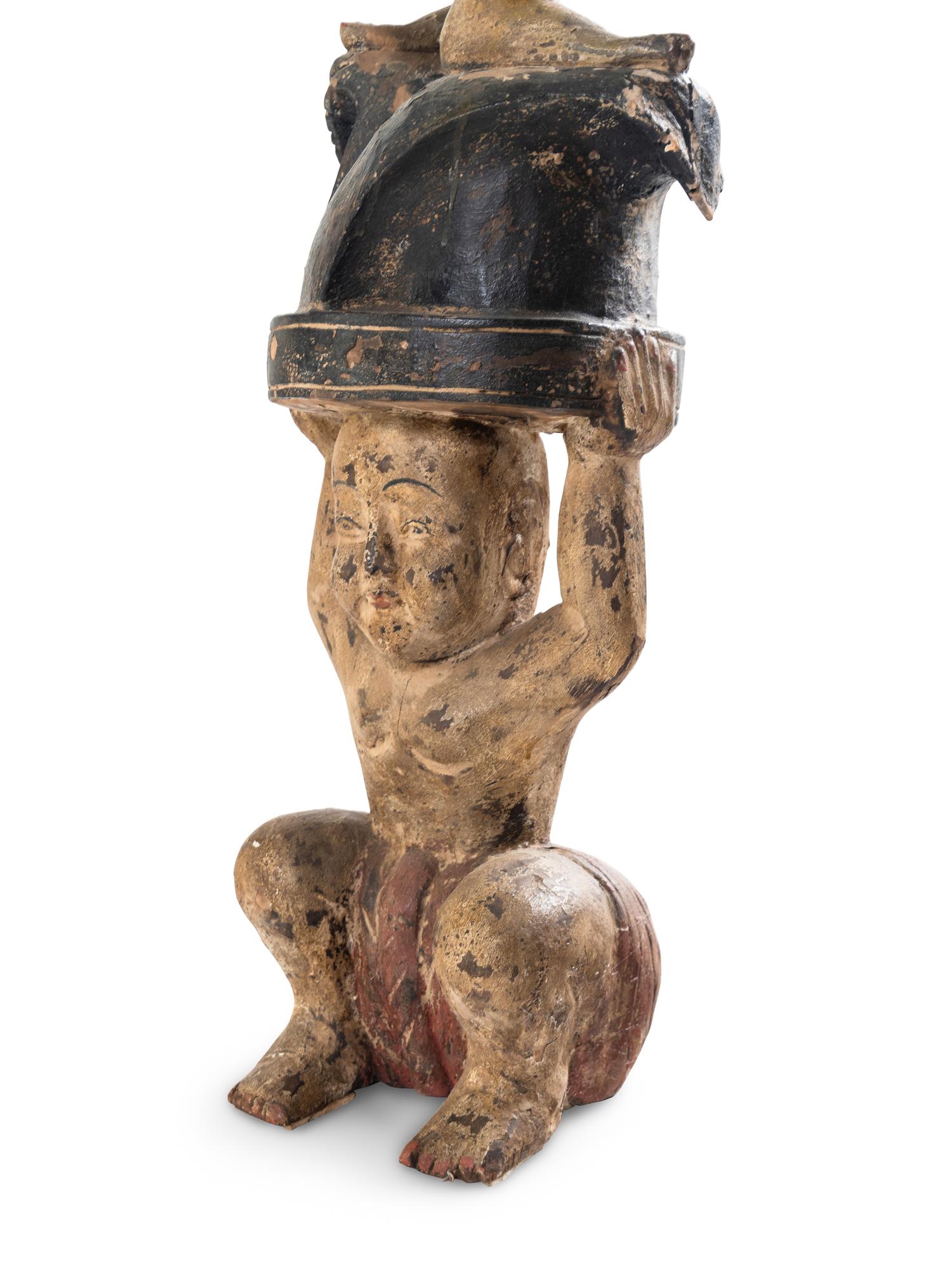 A Pair of Southeast Asian Carved and Polychrome Decorated Figures with a Gong