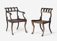 A Set of Three Regency Parcel-Gilt and Ebonized Caned Seat Dining Chairs
