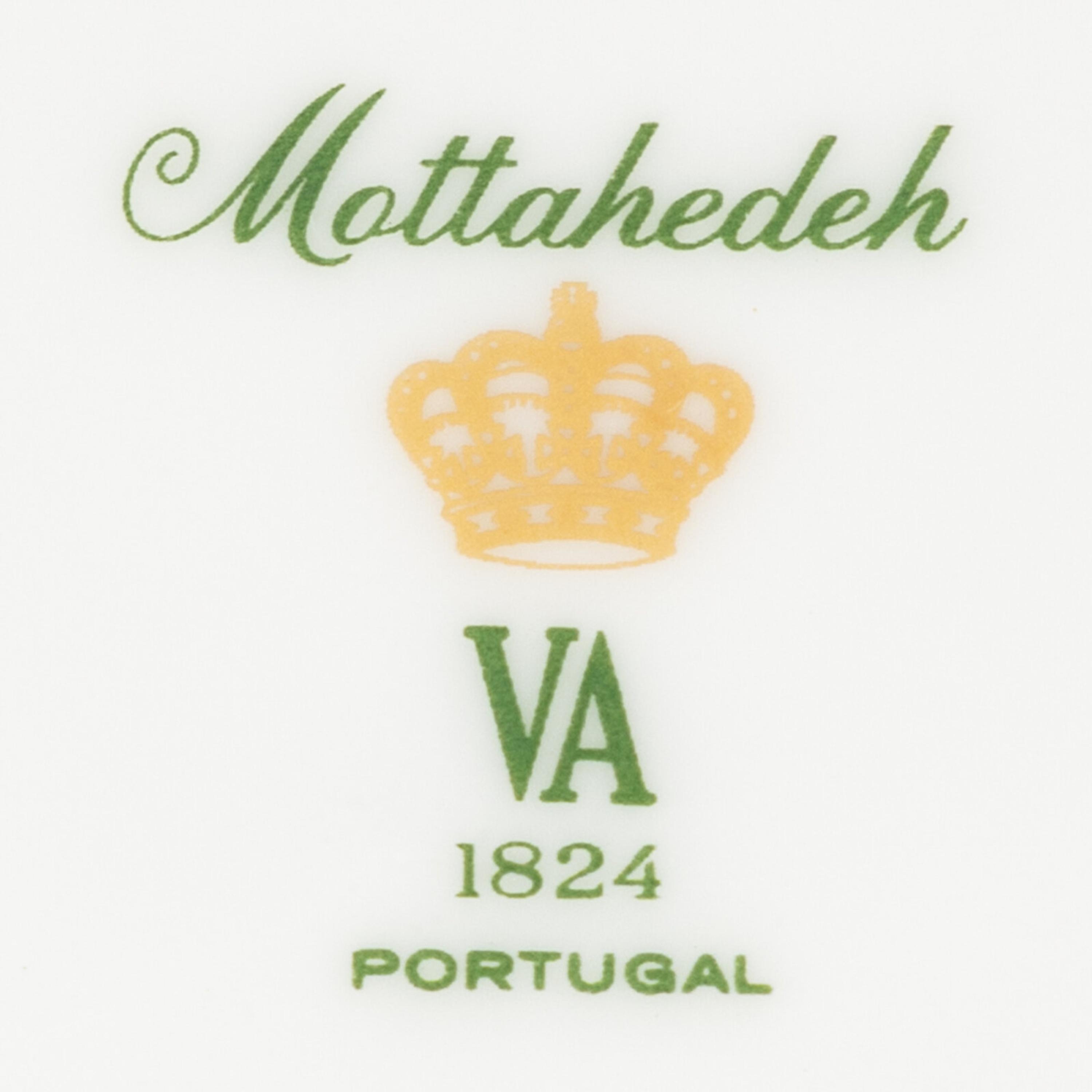 A Collection of Mottahedeh Salmon Porcelain Table Articles