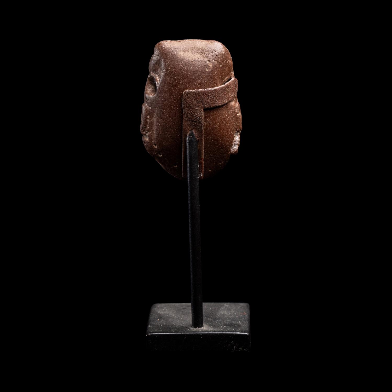 A Maya Stone Head Pendant
