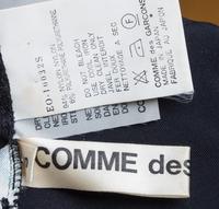 A Comme des Garcons Painted Edge Cutaway Black Dress, Size small.