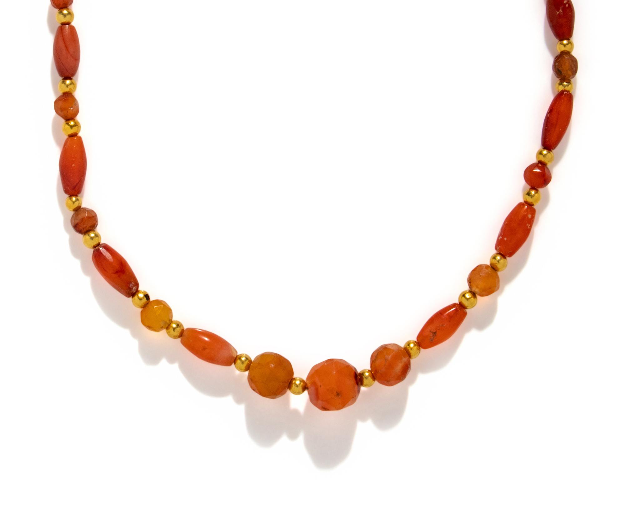 A Near Eastern Gold and Carnelian Bead Necklace