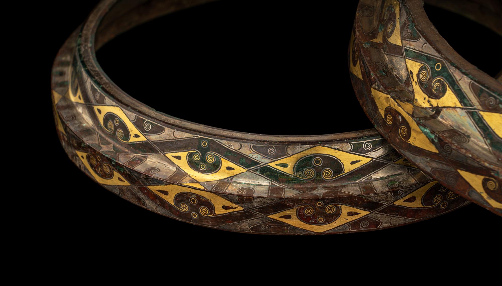 A Group of Four Chinese Gold and Silver Inlaid Bronze Fittings from Hu Vessels