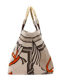 An Hermes Steeple Toile Tote Bag, 22" x 12" x 12".