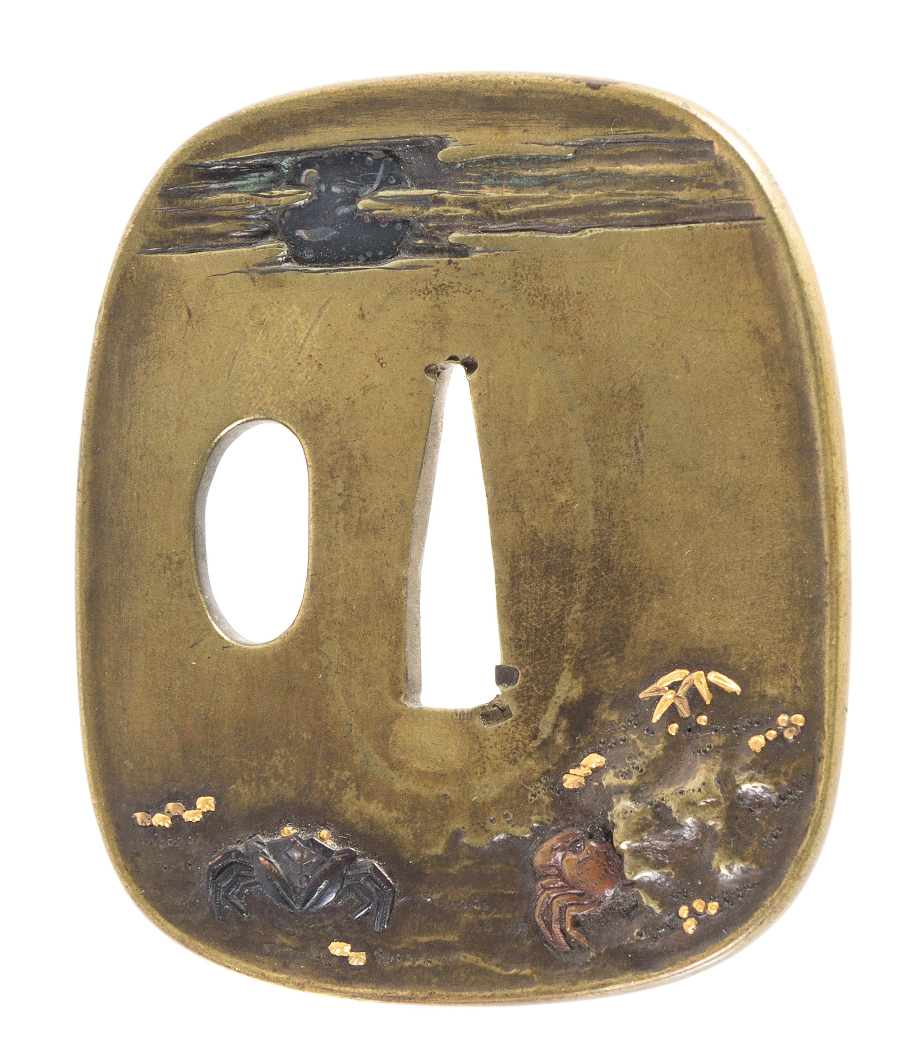 A Copper Tsuba Height 2 3/4 inches.