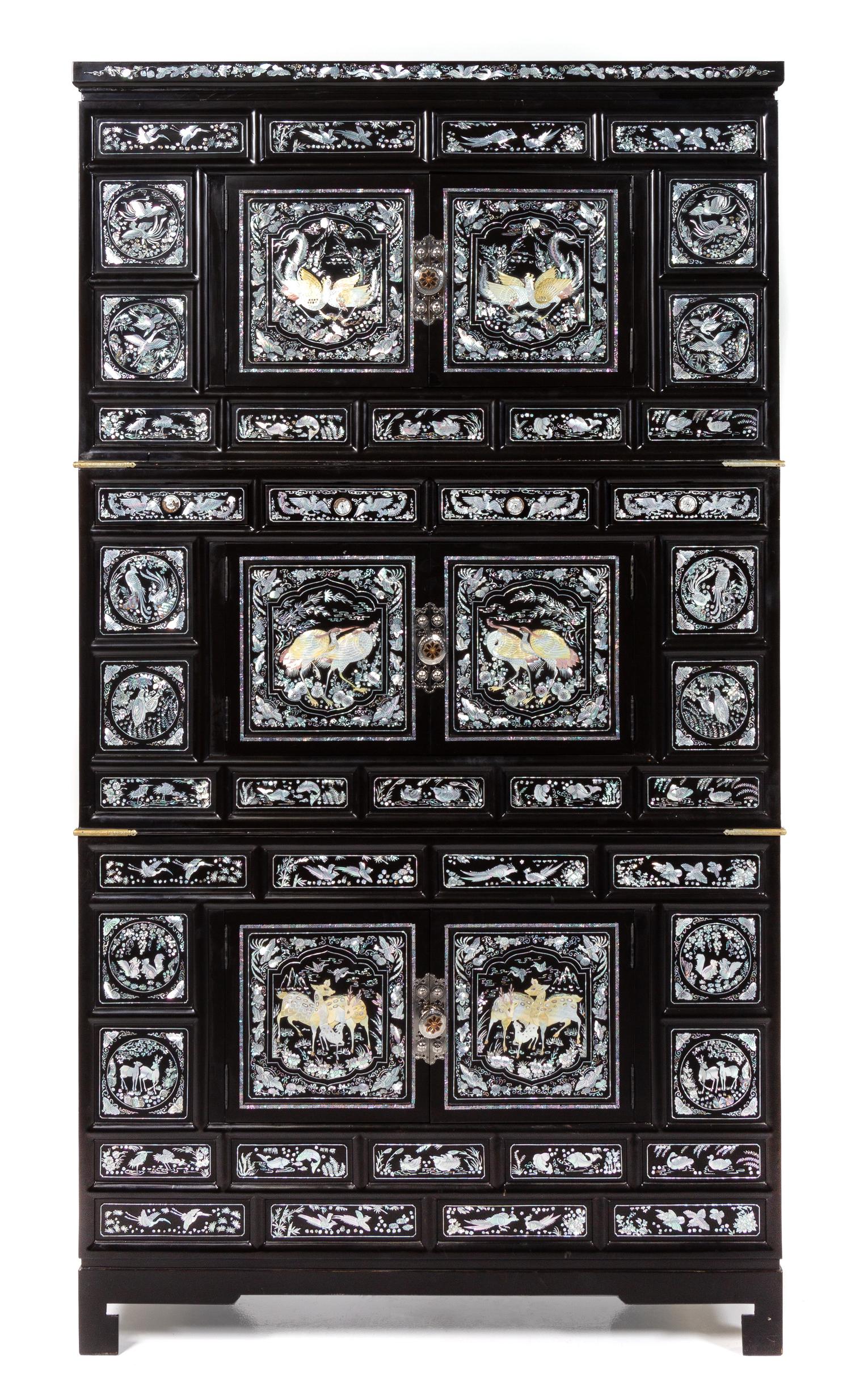 A Korean Mother-of-Pearl Inset Black Lacquer Chest Height overall 73 x width 39 x depth 19 1/2 inches. — 20TH CENTURY
