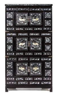 A Korean Mother-of-Pearl Inset Black Lacquer Chest Height overall 73 x width 39 x depth 19 1/2 inches. — 20TH CENTURY