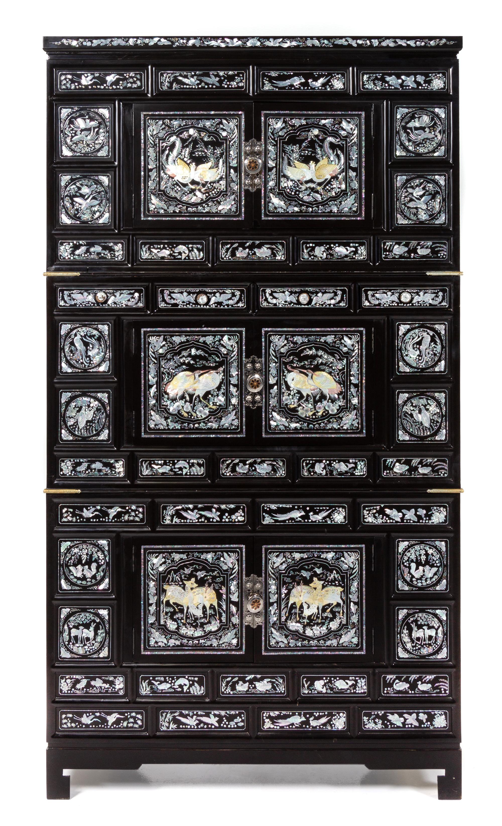 A Korean Mother-of-Pearl Inset Black Lacquer Chest Height overall 73 x width 39 x depth 19 1/2 inches. — 20TH CENTURY
