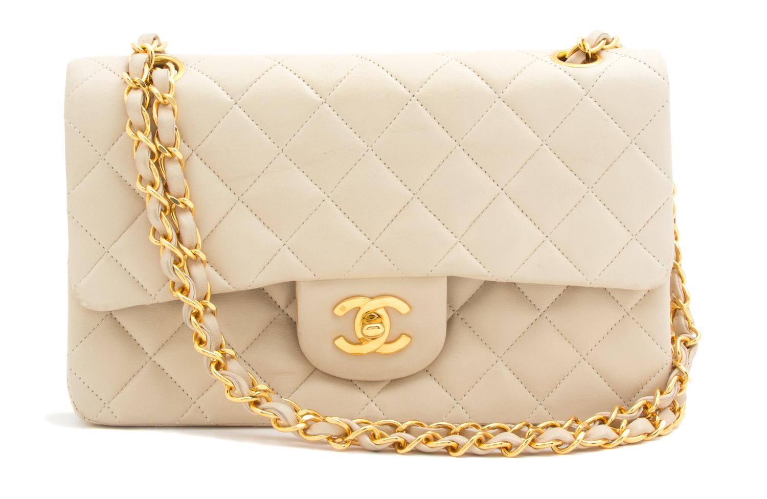 A Chanel Beige Quilted Leather Handbag, 9.25" x 5.5" x 2.5"; Strap drop: 9.75".