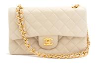 A Chanel Beige Quilted Leather Handbag, 9.25" x 5.5" x 2.5"; Strap drop: 9.75".