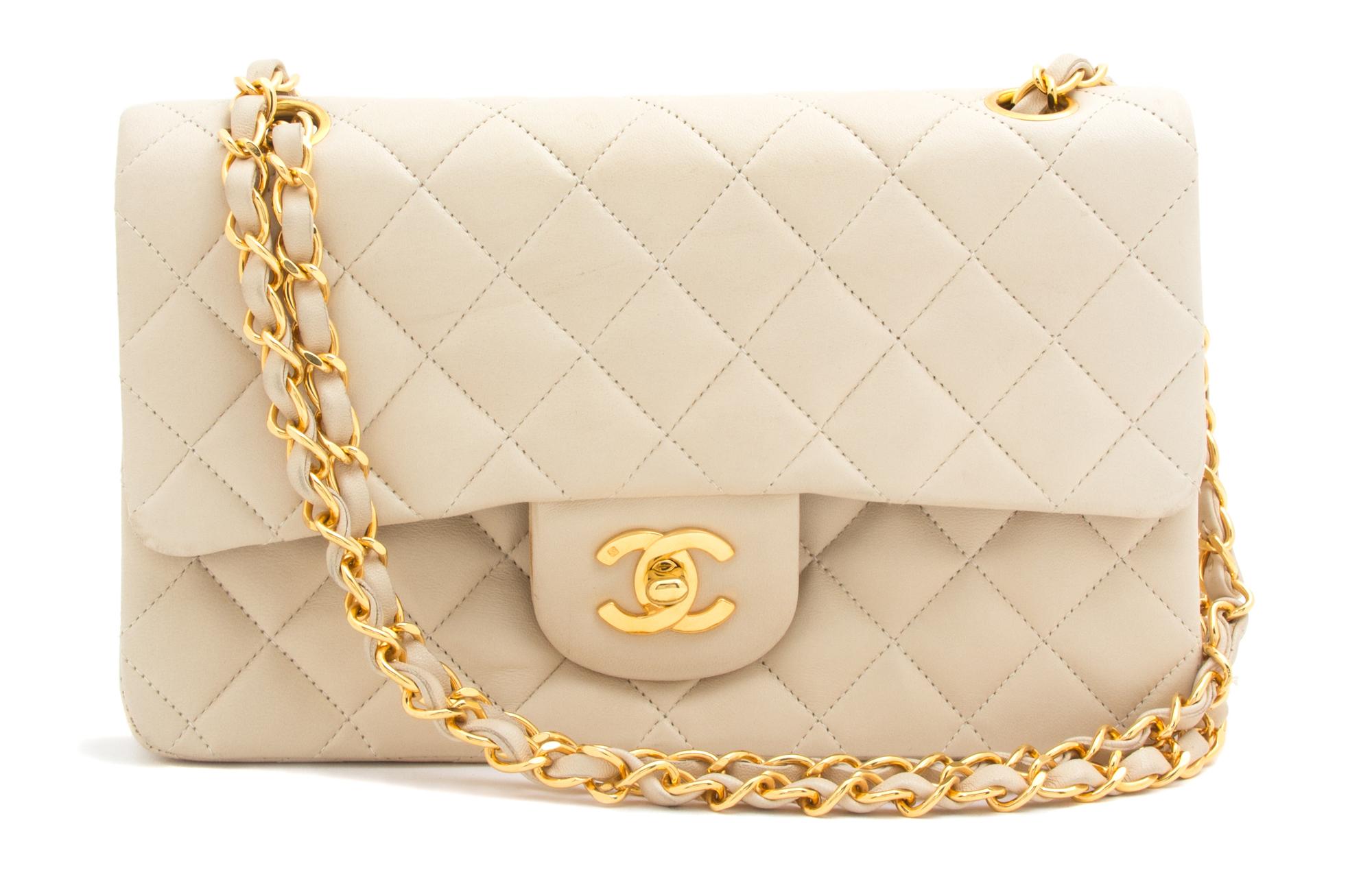 A Chanel Beige Quilted Leather Handbag, 9.25" x 5.5" x 2.5"; Strap drop: 9.75".