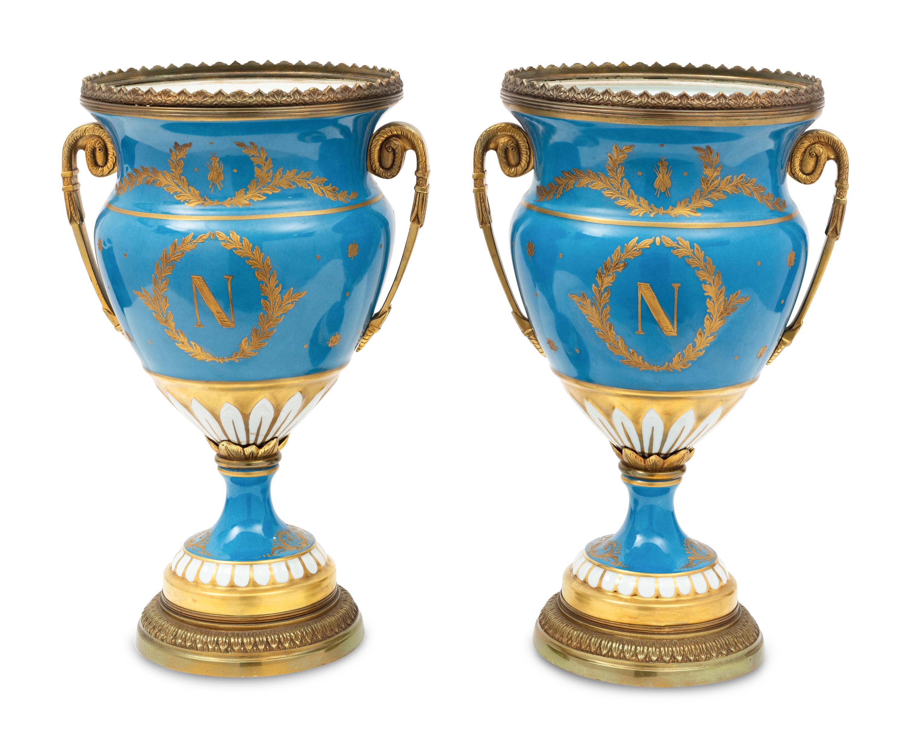 A Pair of Sevres Style Porcelain and Gilt-Bronze Mounted Napoleonic Urns