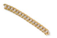 An 18 Karat Yellow Gold, Platinum and Diamond Bracket, 57.40 dwts.