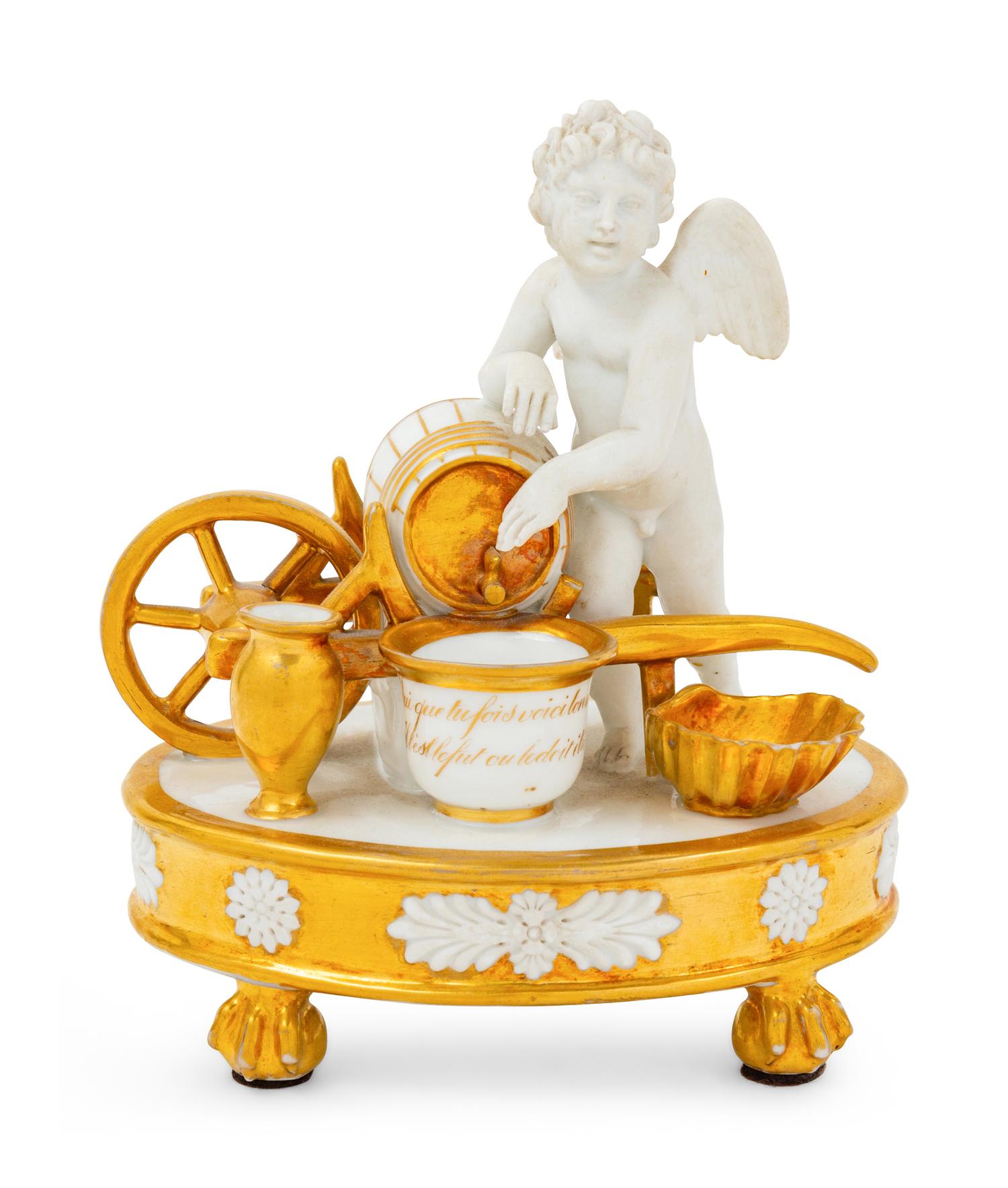 A Paris Porcelain Parcel Gilt Figural Encrier