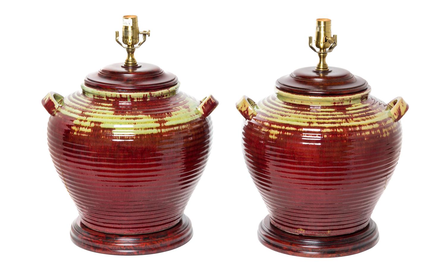 A Pair of Rustic Glazed Pottery Jars Height 20 inches.