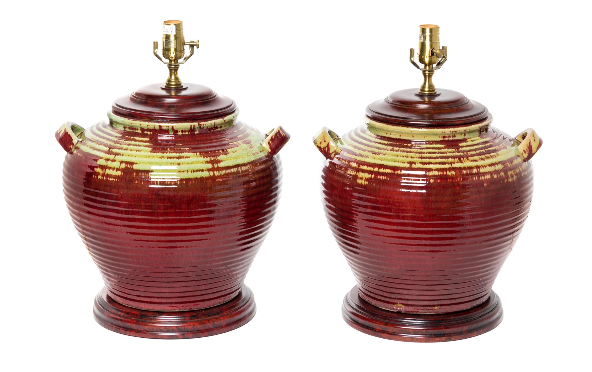 A Pair of Rustic Glazed Pottery Jars Height 20 inches.